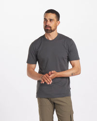 Model is 6'3" and wearing size Large. Model with Hands Together Wearing Charcoal Blue Men's Alpaca Wool T-Shirt – PAKA Apparel
