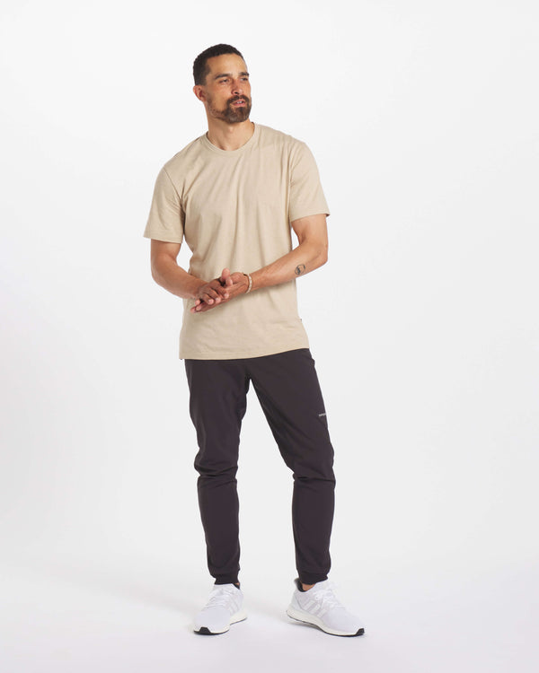 Model Looking Off Camera in Sand / Tan Organic Pima Cotton and Alpaca Blend  Men's T-Shirt – PAKA Apparel