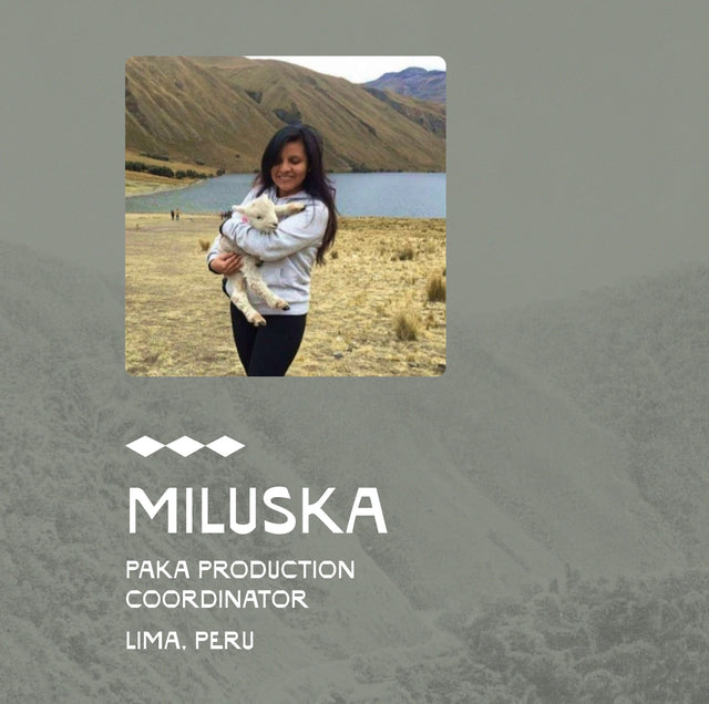 Woman standing in a grassy highland wearing a light sweater with a three-star graphic and overlaid name and role text