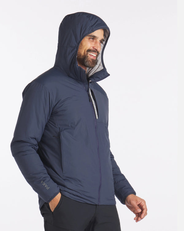 Man Smiling with Hood Up of Navy Blue Apu Lightweight Puffer Jacket – PAKA Apparel
