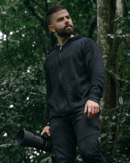 Man wearing our black Breathe Men's Full Zip and joggers in the nature