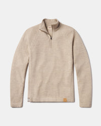 Flat lay of The Quarter Zip alpaca sweater showing quarter-zip collar, raglan sleeves, and leather logo patch on white background