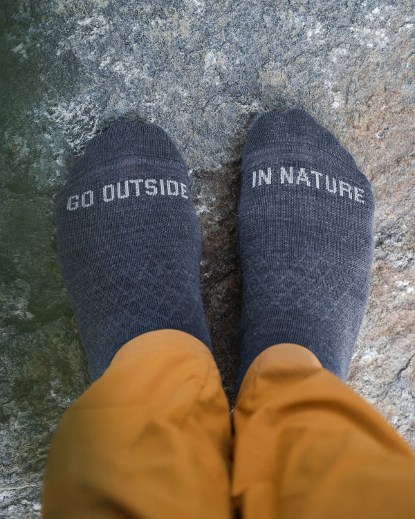 Charcoal Blue Trail Lightweight Alpaca Quarter Crew Outdoor Socks on Feet from Above with “Go Outside in Nature” Text – PAKA Apparel