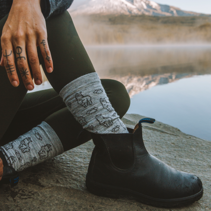Sitting by a lake in our comfy and cute Sebastian socks