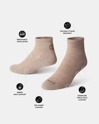 Angled view of Trail 1/4 Crew socks in tan showing breathable ventilation, ribbed arch support, toe-guard and triple-sole cushioning on white background