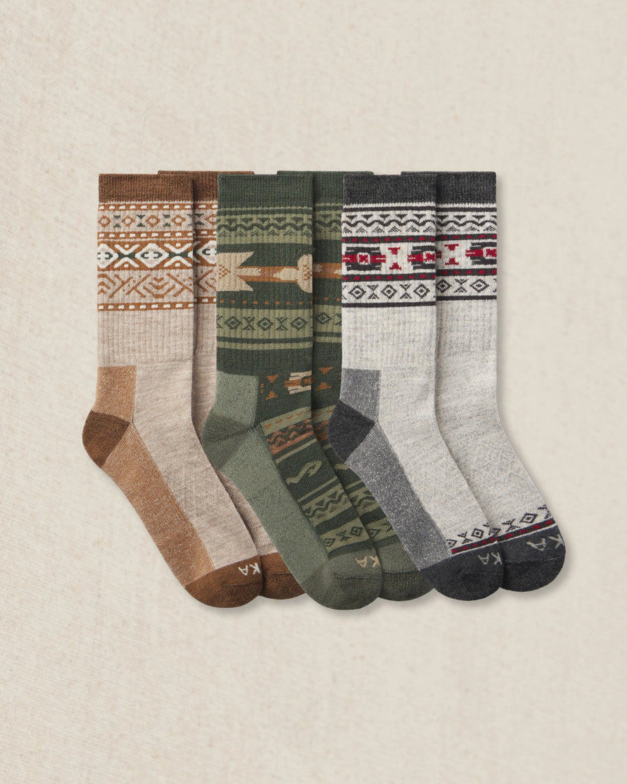 Set of 3 patterned socks on a beige background