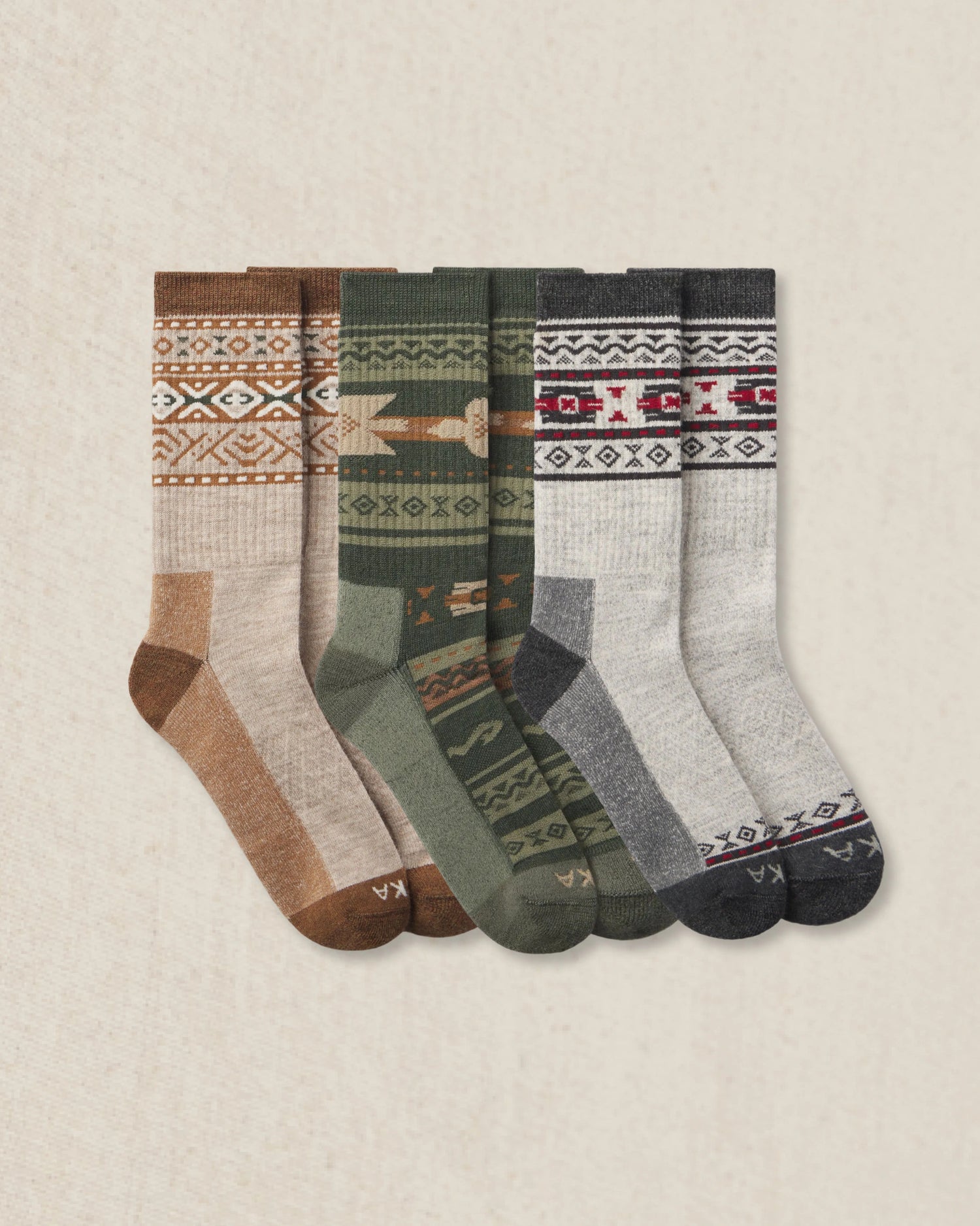 Set of 3 patterned socks on a beige background