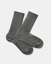 Angled view of Trail 3/4 Crew Socks in black showing ribbed cuff, cushioned footbed, and PAKA logo on a light background
