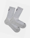 Angled flat lay of Trail Crew socks, light gray alpaca blend with cushioned sole and ribbed crew height on white background