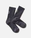 Top-down view of Trail Crew Socks showcasing charcoal blue color, crew height, cushioned footbed and PAKA logo on white background
