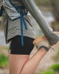 Trail Runner Stretching Leg Wearing Forage / Grey Alpaca Ankle Socks – PAKA Apparel