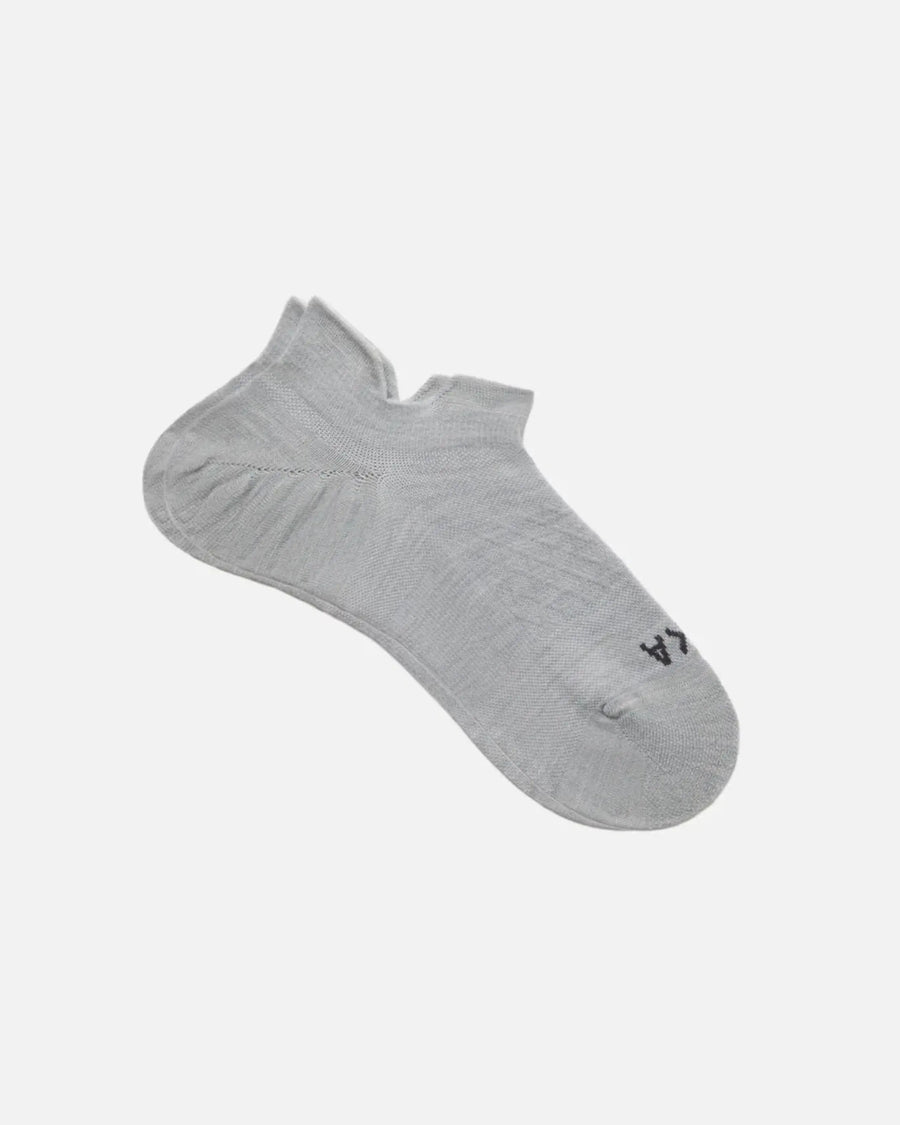 Angled view of Trail Ankle Socks showing low-cut ankle, alpaca blend knit and cushioned heel on white background