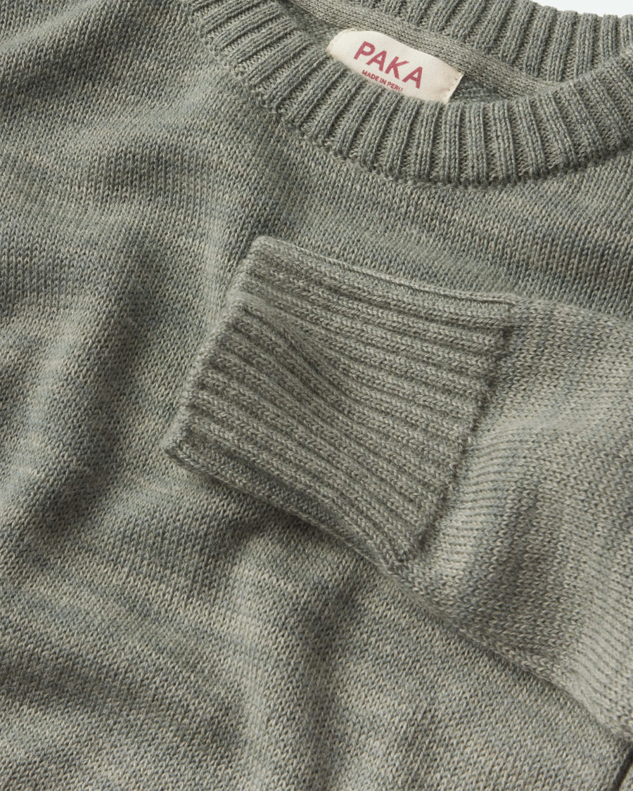 Close-up of the Women's Original Crew sweater in Willow with 'PAKA' label on collar