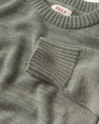 Close-up of the Women's Original Crew sweater in Willow with 'PAKA' label on collar