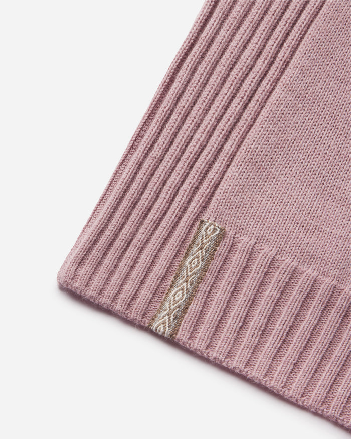 Close-up of a pink knitted product with an Inca ID on a white background