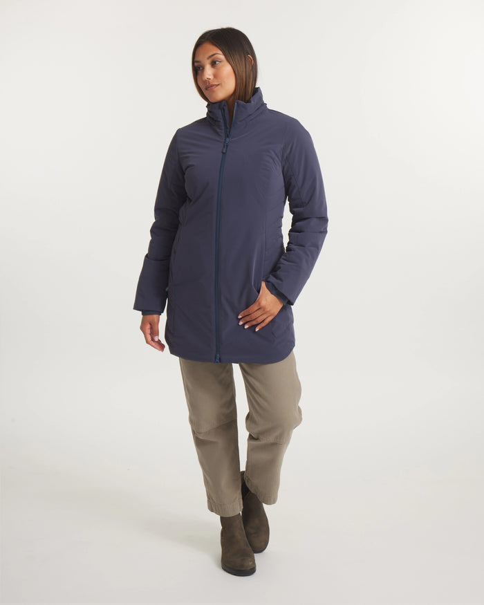 Woman wearing a blue jacket on a white background