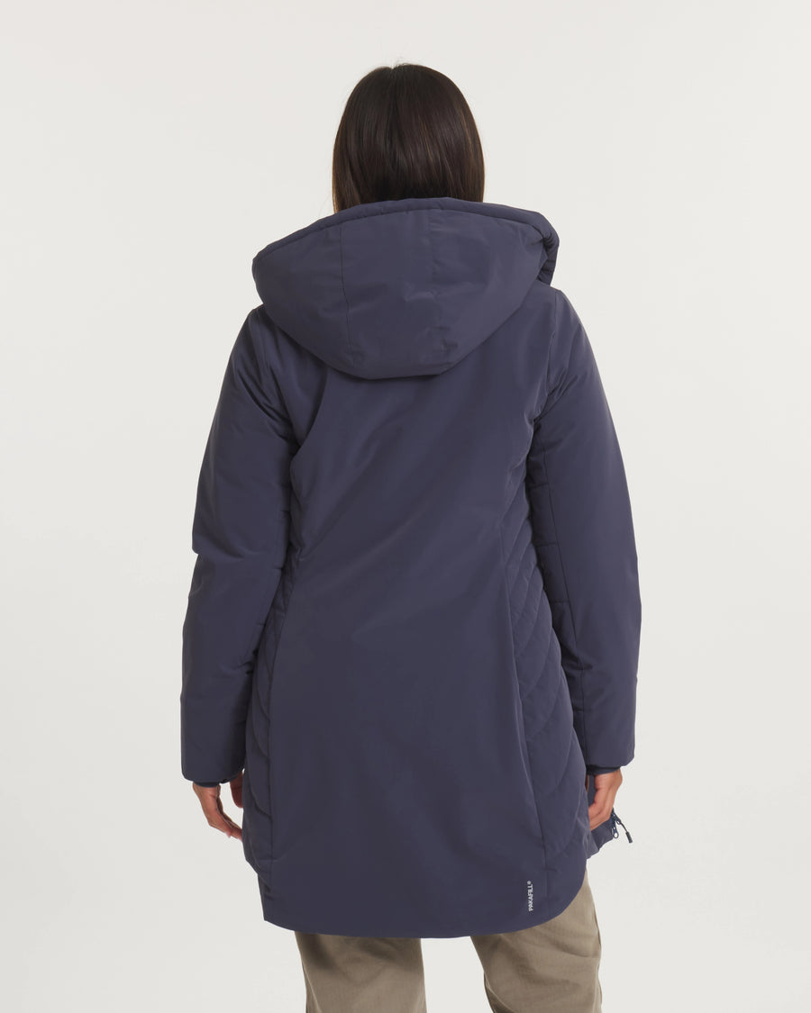 Person wearing a long dark blue coat on a white background