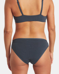 Rear view of Women’s Essential Bikini Brief in navy showcasing low-profile bikini cut and soft moisture-wicking natural-fiber fabric on white background