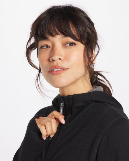 Woman Wearing Baby Alpaca Wool Full-Zip Hoodie in Black - PAKA Apparel
