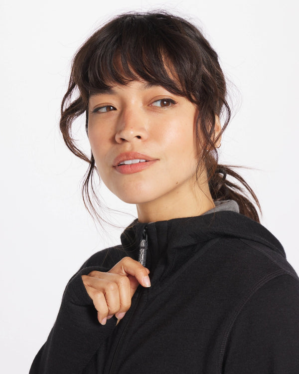 Woman Wearing Baby Alpaca Wool Full-Zip Hoodie in Black - PAKA Apparel