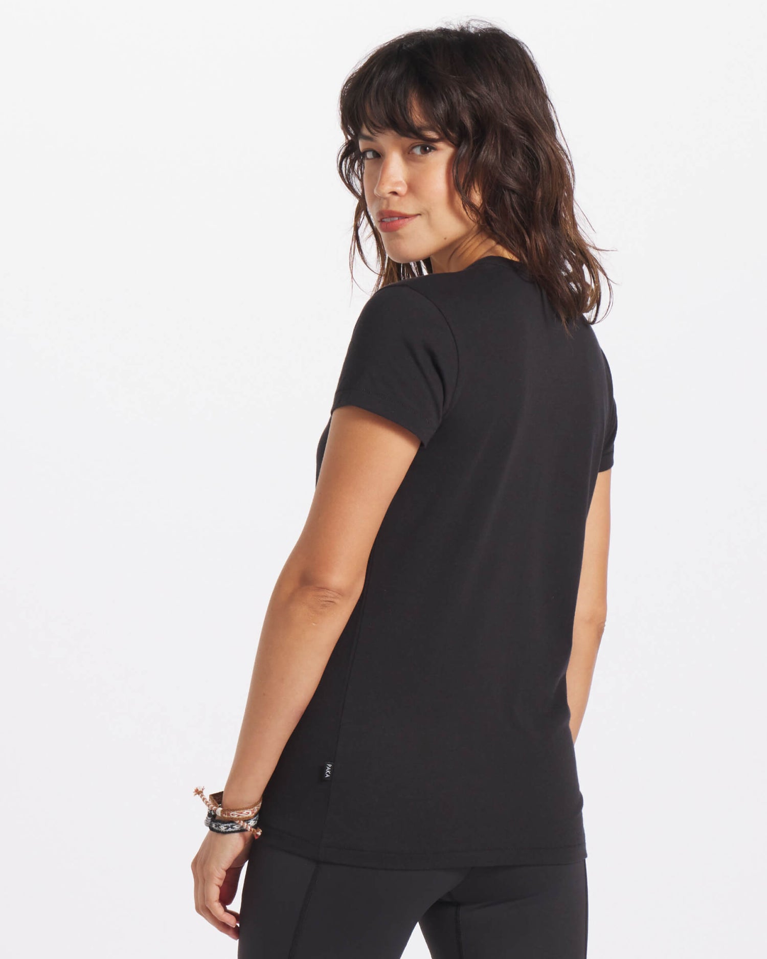 Woman's v neck tee in black on model 