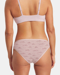 Back view of Essential Printed Bikini Brief in Smokey Lavender showing mountain print and mid-rise fit on model