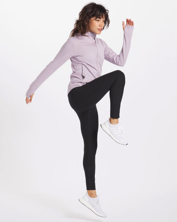 A woman exercising wearing the breathe full zip in lavender