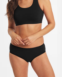 Jess is 5’7”, hips 35”, waist 26”, chest 32A and wearing a size XS.