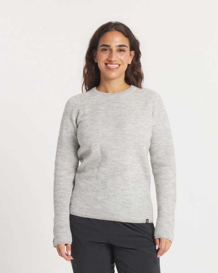 Woman wearing the Women's Mountain Crew Sweater in Light Grey  on a white background
