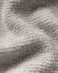Close-up of a textured Women's Mountain Crew Sweater in Light Grey 