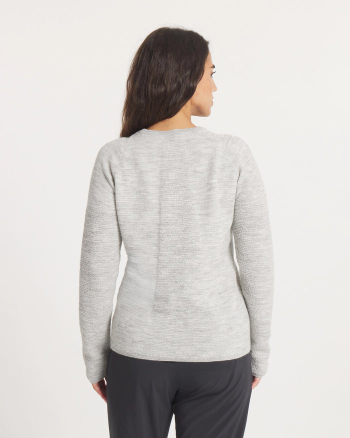 Woman wearing the Women's Mountain Crew Sweater in Light Grey  on a white background