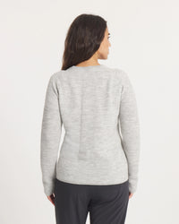 Woman wearing the Women's Mountain Crew Sweater in Light Grey  on a white background