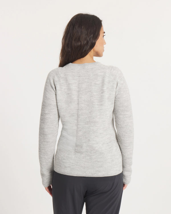 Woman wearing the Women's Mountain Crew Sweater in Light Grey  on a white background