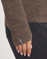 Women's Mountain Crew sweater in Wood closeup with a brand logo on a white background