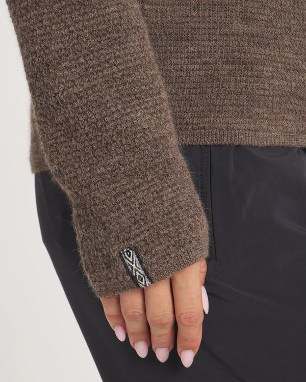 Women's Mountain Crew sweater in Wood closeup with a brand logo on a white background