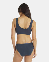Back view of Women’s Essential Scoop Bralette in navy showcasing wide straps and scoop back on light gray background