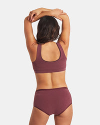 Back view of Essential Scoop Bralette in raisin on model showing wide straps, scoop back, and breathable alpaca fabric