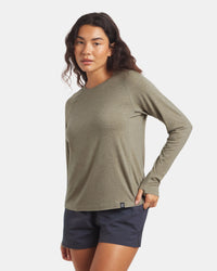 Front three-quarter view of Women’s Sol Crew sun shirt with raglan sleeves and thumbhole cuff on white background