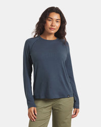 Front view of Women’s Sol Crew sun-protection shirt in navy on model, relaxed fit with crew neckline and raglan sleeves