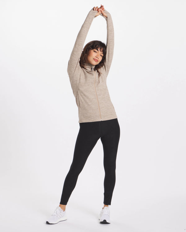 Woman stretching in Women's Tan Breathe Full Zip