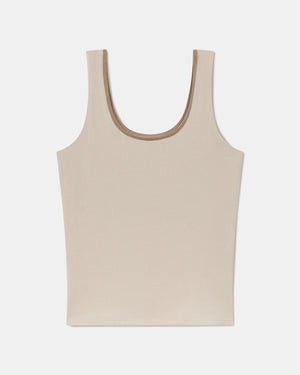 Flat lay of Women’s Essential Tank showing scoop neckline and built-in shelf bra in birch on white background
