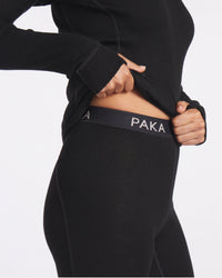 Close-Up of Woman Showing Midriff in Black Alpaca Wool Thermal Baselayers for Winter – PAKA Apparel
