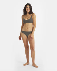 Front view of Womens Essential Triangle Bralette in forage on model; deep V wireless cups, Inca straps, breathable fabric