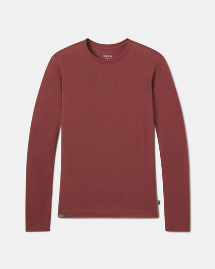 PAKA Women's Clay Aire Long Sleeve flatlay on a greyish white background