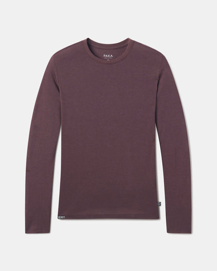 PAKA Women's AIre Long Sleeve in Fig flatlay against a white grey background