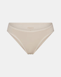 Front view of Women’s Essential Bikini Brief in Bone showing mid-rise cut, elastic trim, and interior PAKA logo on light gray background