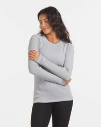 Woman with Arms Crossed in Cozy Silver / Light Grey Alpaca Wool Thermal Long Underwear Top – PAKA Apparel