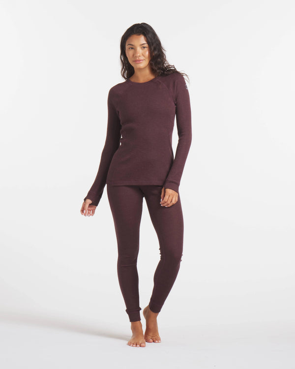 Full Height Shot of Woman in Uva / Dark Purple Alpaca Wool Thermal Baselayer Shirt for Skiing, Snowboarding and Winter – PAKA Apparel