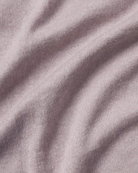 Close-up of textured purple fabric with folds
