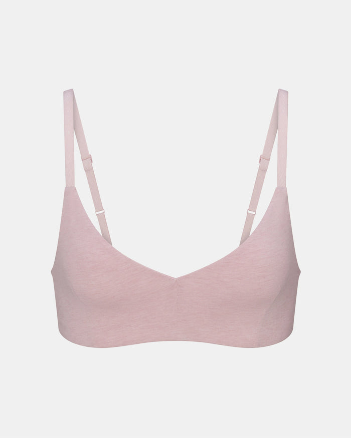 Pink bralette on a light gray background